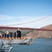 USS Tripoli Sailors man the rails while pullinig in to San Francisco