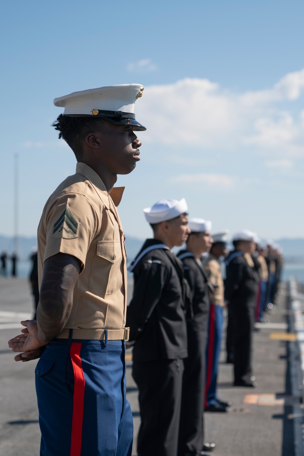 USS Tripoli Sailors man the rails while pullinig in to San Francisco