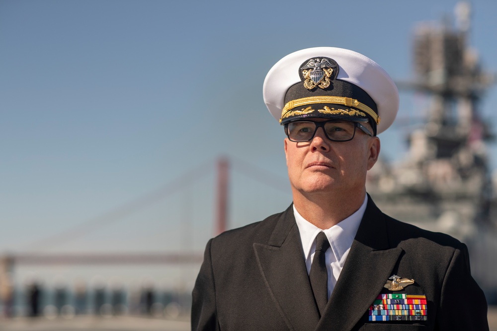 USS Tripoli Sailors man the rails while pulling into San Francisco