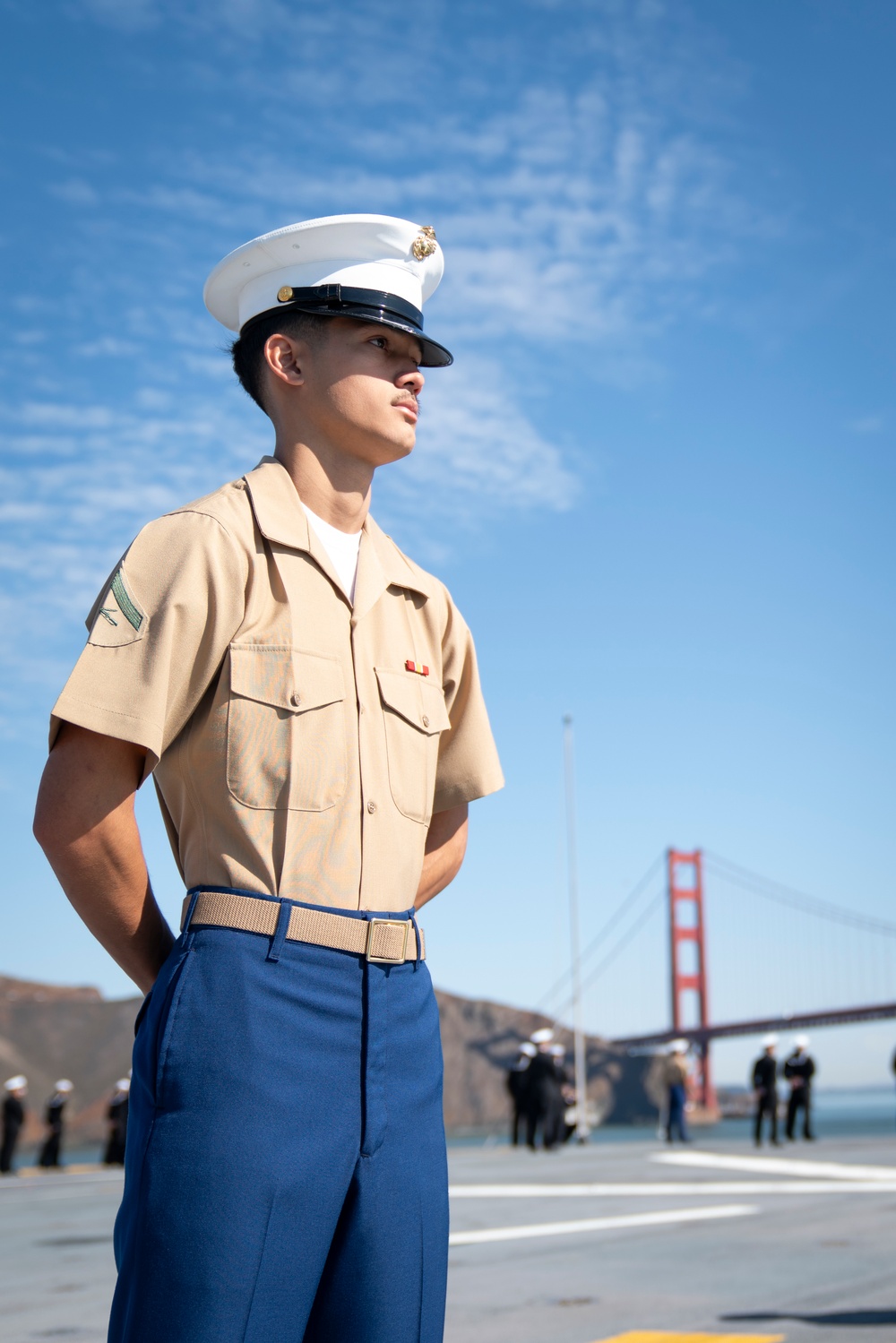 USS Tripoli Sailors man the rails while pullinig in to San Francisco