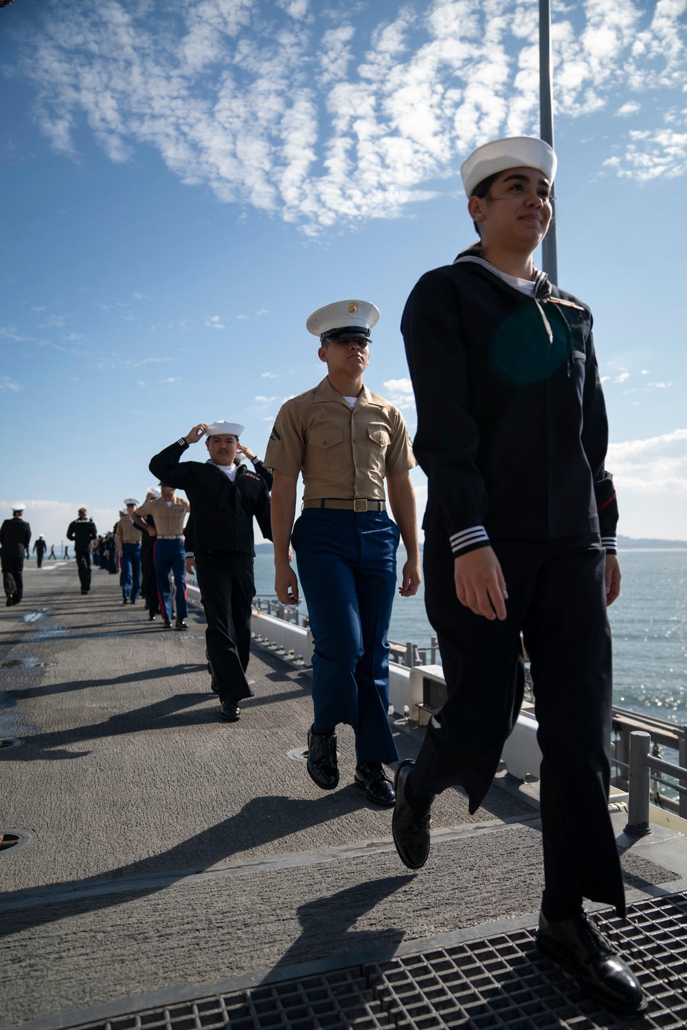 USS Tripoli Sailors man the rails while pullinig in to San Francisco