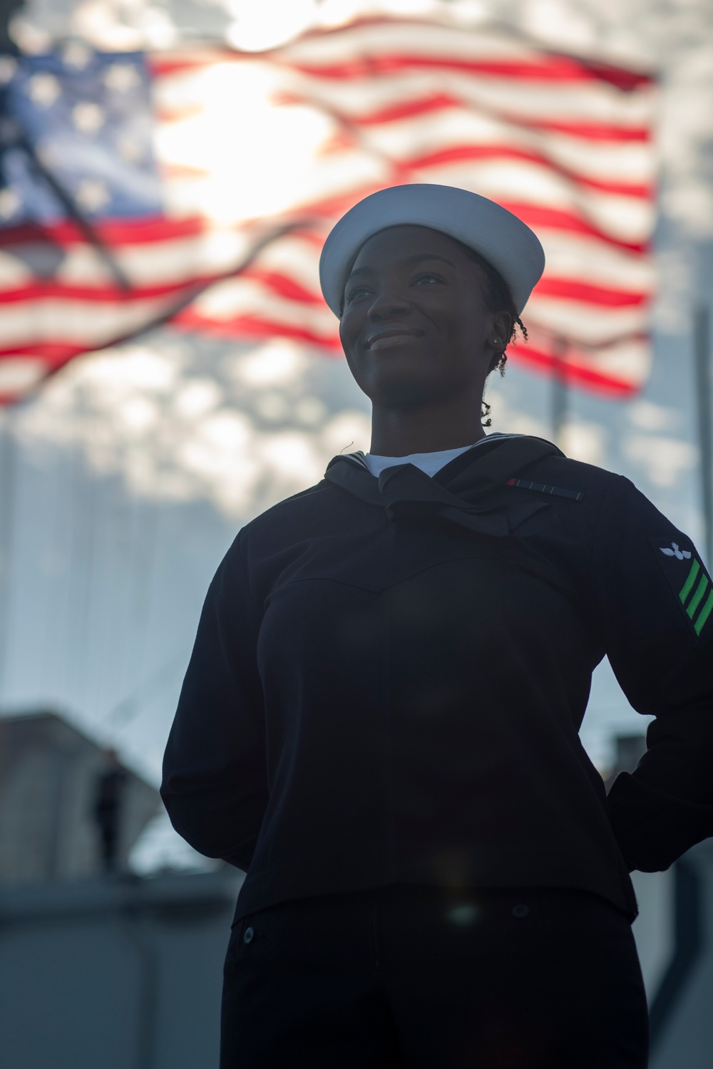 USS Tripoli Sailors man the rails while pulling into San Francisco