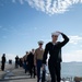 USS Tripoli Sailors man the rails while pullinig in to San Francisco