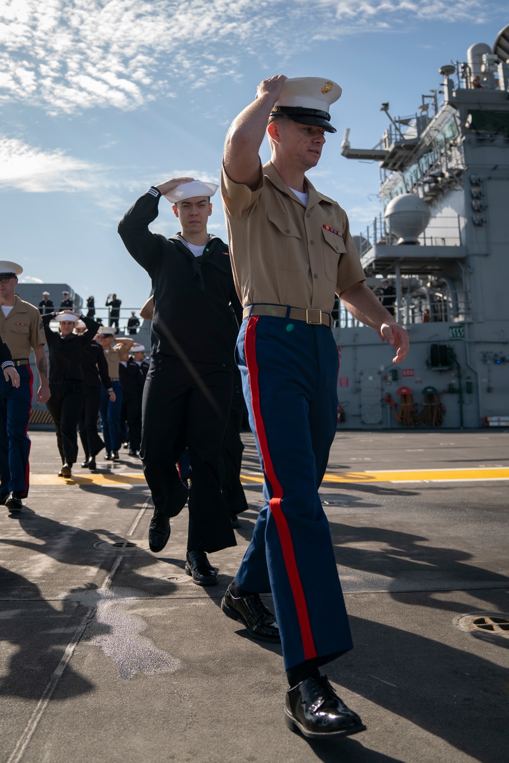 USS Tripoli Sailors man the rails while pullinig in to San Francisco