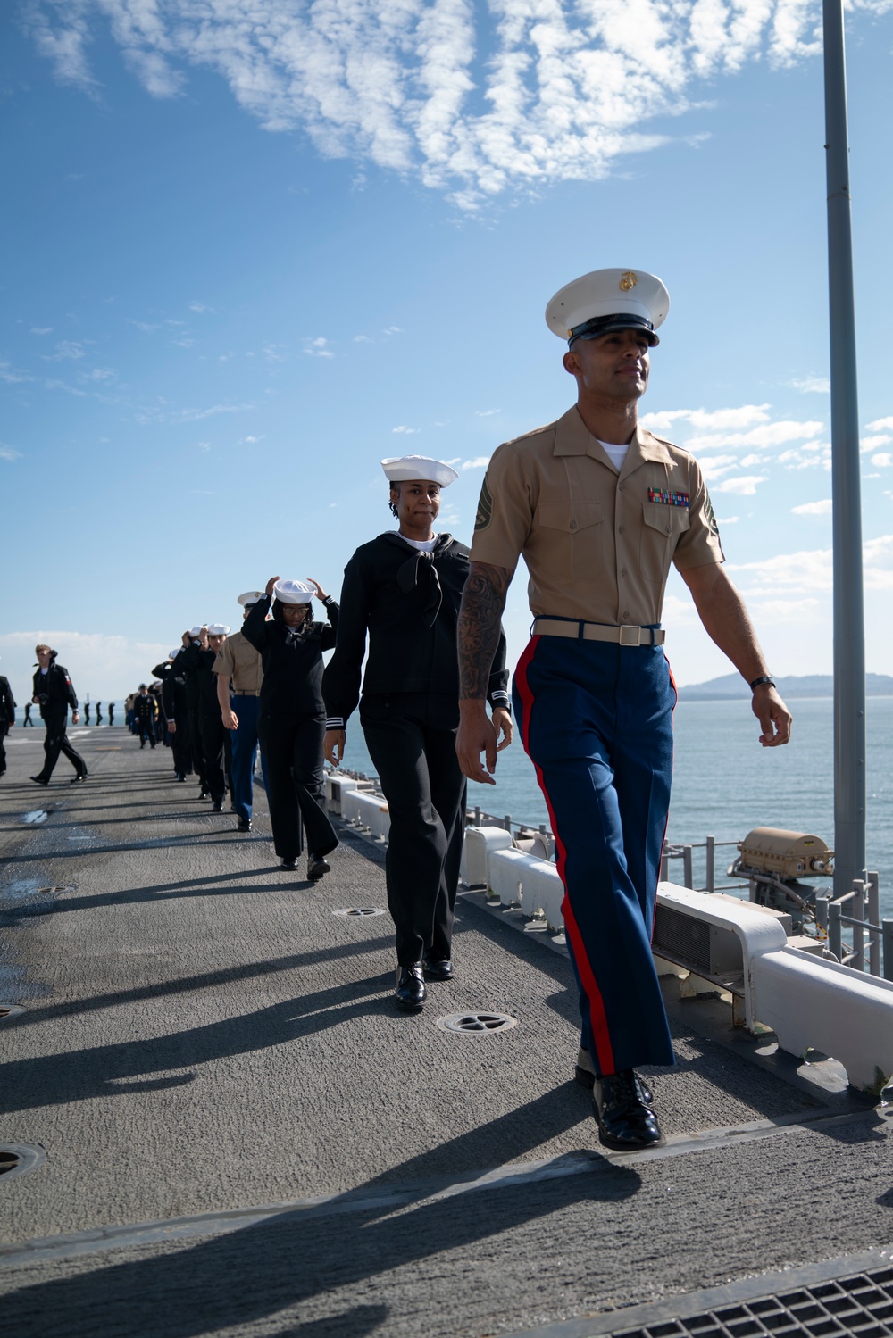 USS Tripoli Sailors man the rails while pullinig in to San Francisco