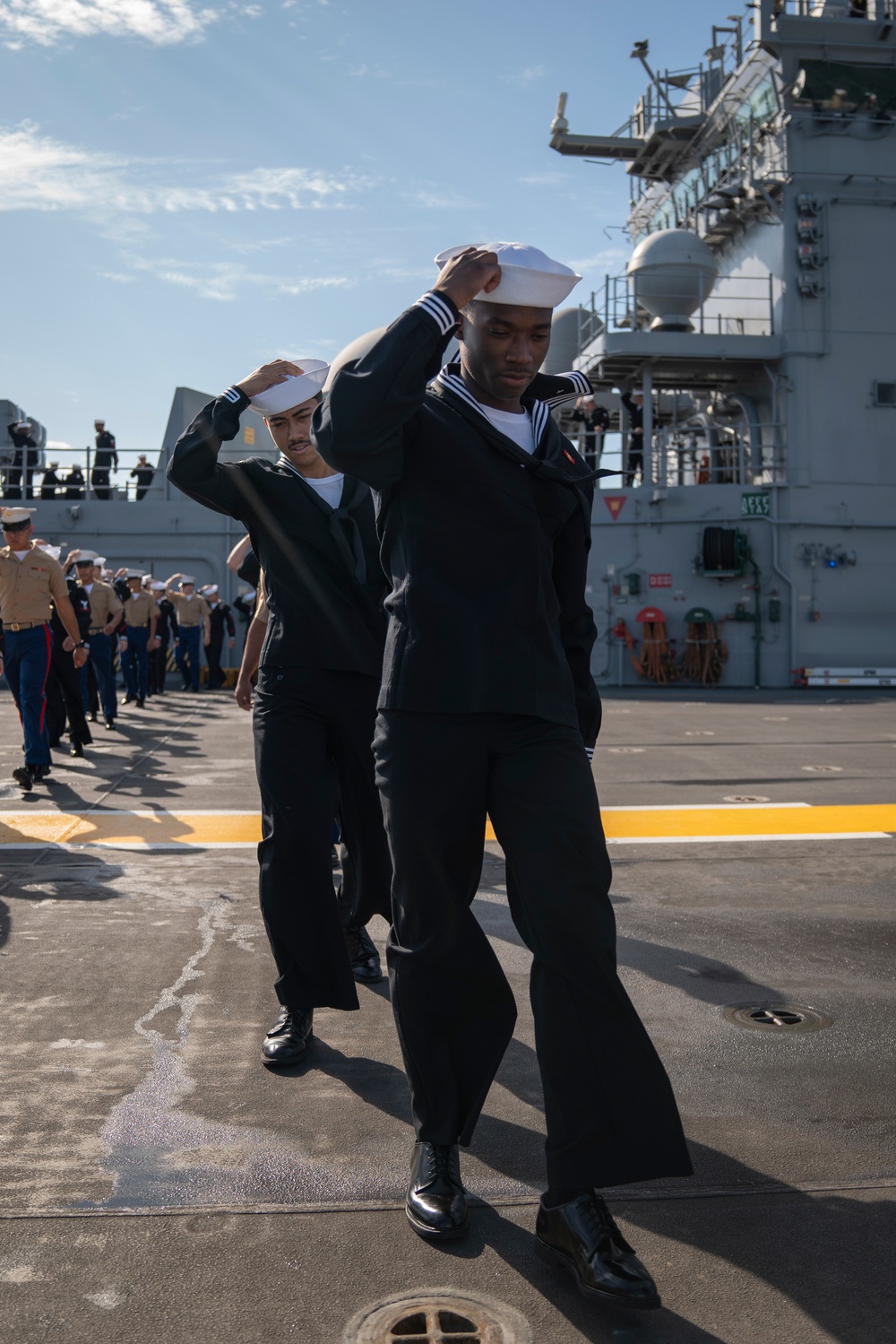 USS Tripoli Sailors man the rails while pullinig in to San Francisco