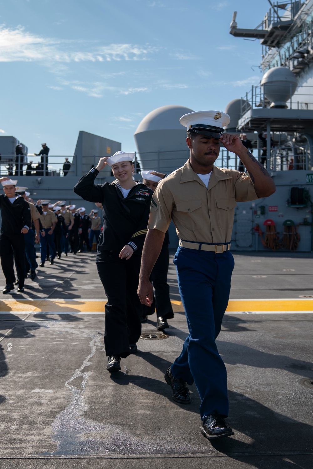 USS Tripoli Sailors man the rails while pullinig in to San Francisco