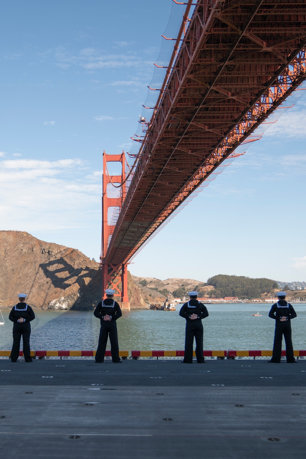 USS Tripoli Sailors man the rails while pullinig in to San Francisco