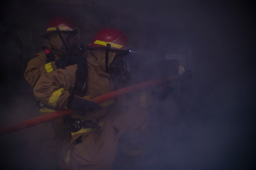 USS Tripolis sailors conduct fire dills with San francisco fire department