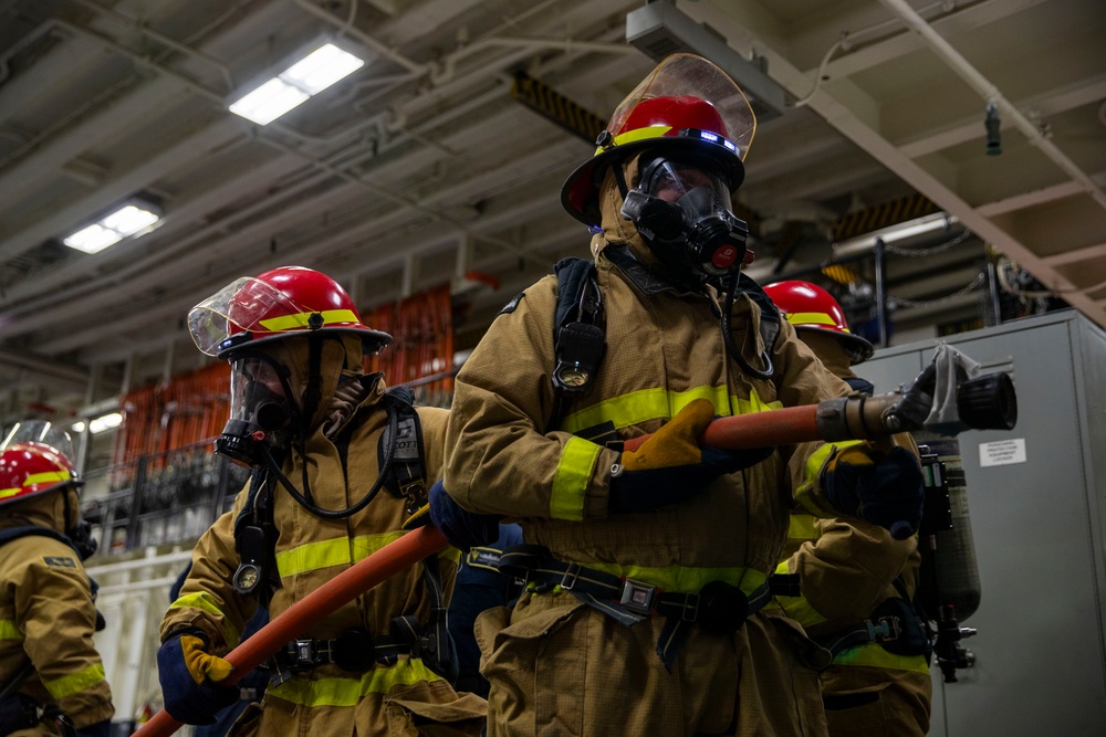 USS Tripolis sailors conduct fire dills with San francisco fire department