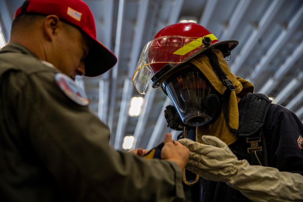 USS Tripolis sailors conduct fire dills with San francisco fire department