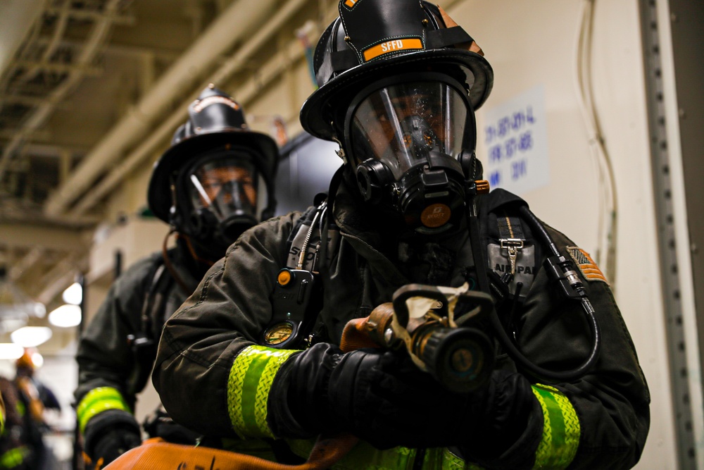 USS Tripolis sailors conduct fire dills with San francisco fire department