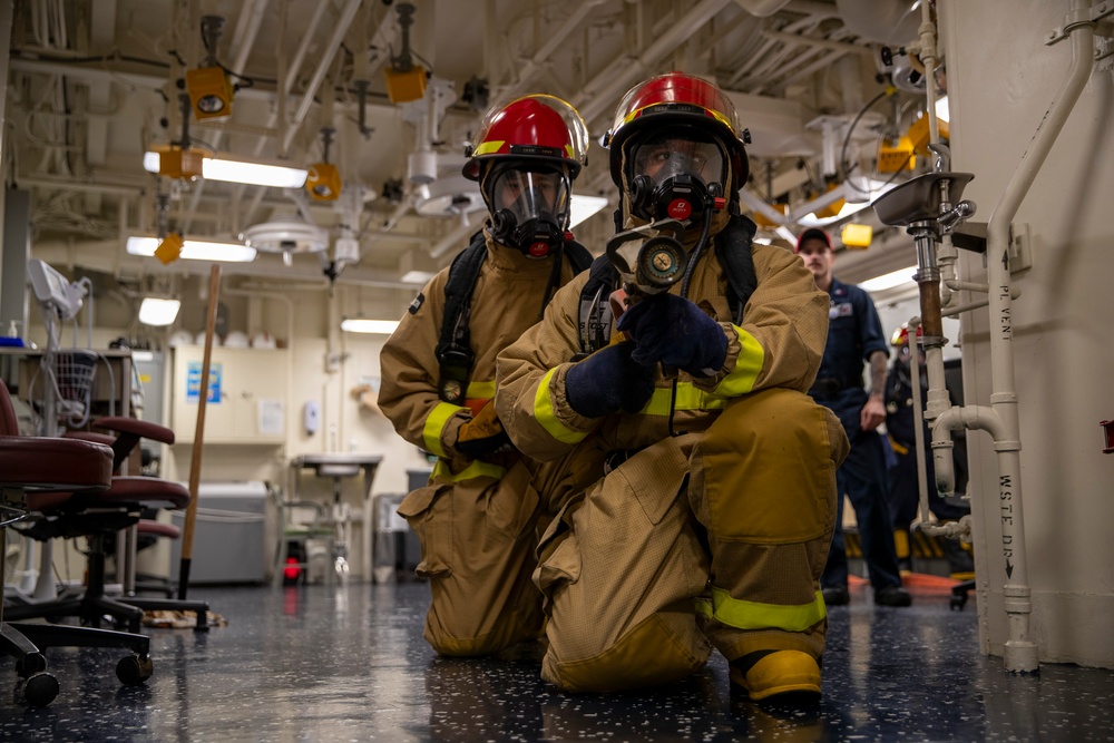 USS Tripolis sailors conduct fire dills with San francisco fire department