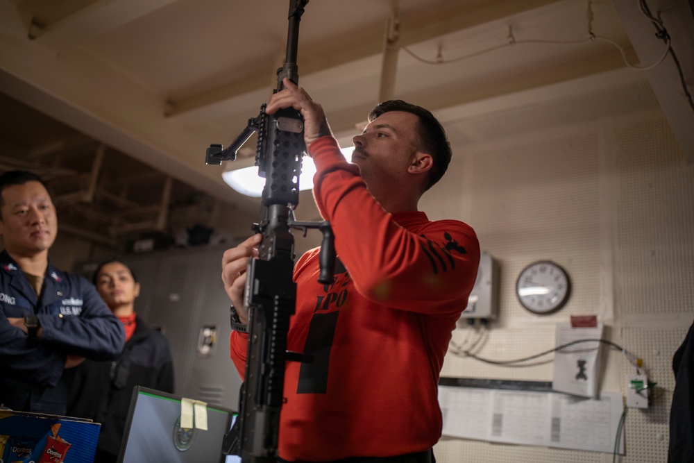 USS Tripoli Sailors Prepare for weapons qualifications