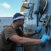 Sailors aboard the USS Howard conduct ship preservation efforts in the South China Sea