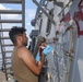 Sailors aboard the USS Howard conduct ship preservation efforts in the South China Sea