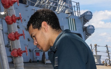 Sailors aboard the USS Howard conduct ship preservation efforts in the South China Sea