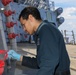 Sailors aboard the USS Howard conduct ship preservation efforts in the South China Sea