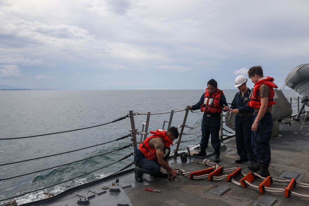 Sailors aboard the USS Howard conduct a sea and anchor detail in Subic Bay, Philippines