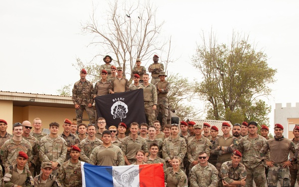 French and U.S. forces conduct close quarter combat training.