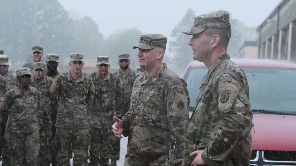 Soldiers hit by downpour, seasonal flood, during formation