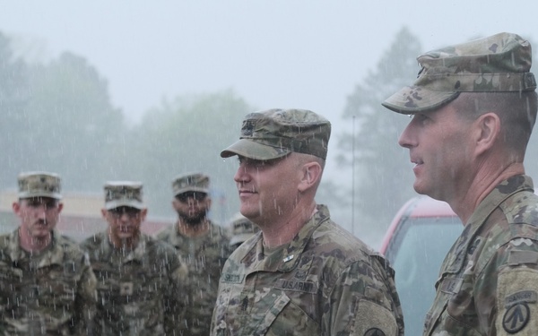 Soldiers hit by downpour, seasonal flood, during formation