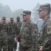 Soldiers hit by downpour, seasonal flood, during formation