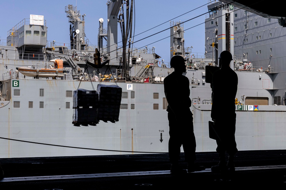 Abraham Lincoln conducts a replenishment-at-sea with Amelia Earhart