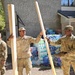 Screaming Eagles Soldiers assist volunteers at a church