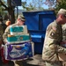 Screaming Eagles Soldiers assist volunteers at a church