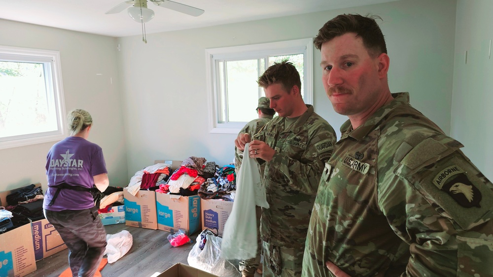 Screaming Eagles Soldiers assist volunteers at a church