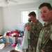 Screaming Eagles Soldiers assist volunteers at a church