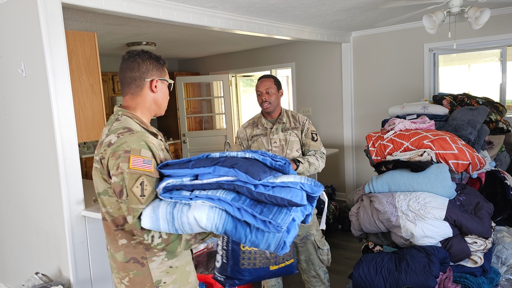 Screaming Eagles Soldiers assist volunteers at a church