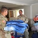 Screaming Eagles Soldiers assist volunteers at a church