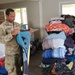 Screaming Eagles Soldiers assist volunteers at a church