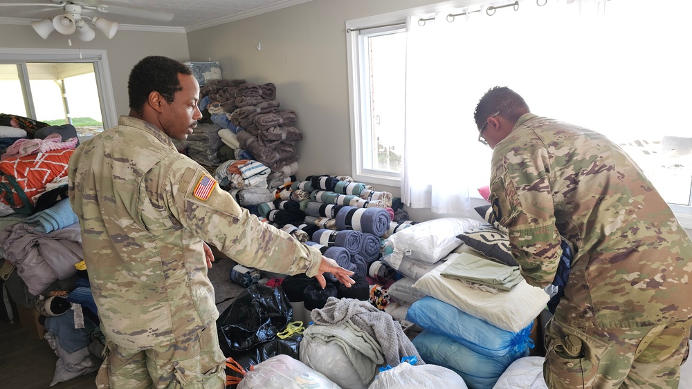 Screaming Eagles Soldiers assist volunteers at a church