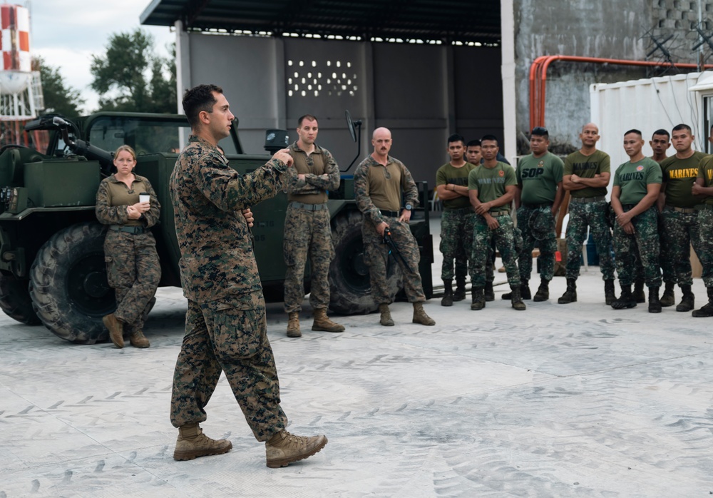 U.S., Philippine Marines conduct safety brief before loading Ospreys in Laoag to Support Relief Efforts Alongside Philippine Allies