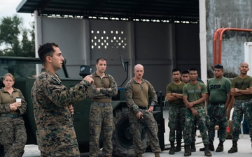 U.S., Philippine Marines conduct safety brief before loading Ospreys in Laoag to Support Relief Efforts Alongside Philippine Allies