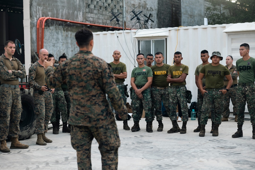 U.S., Philippine Marines conduct safety brief before loading Ospreys in Laoag to Support Relief Efforts Alongside Philippine Allies