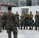 U.S., Philippine Marines conduct safety brief before loading Ospreys in Laoag to Support Relief Efforts Alongside Philippine Allies