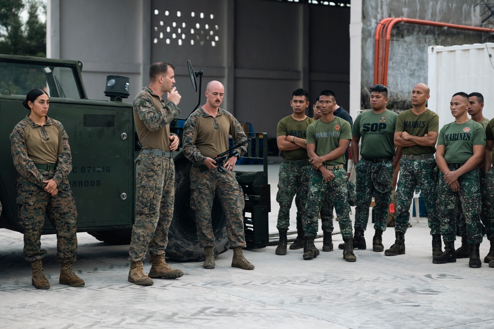 U.S., Philippine Marines conduct safety brief before loading Ospreys in Laoag to Support Relief Efforts Alongside Philippine Allies