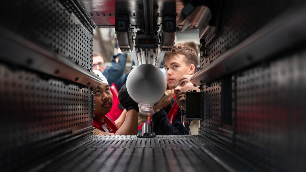 USS George Washington Sailors upload NATO Seasparrow Missile System