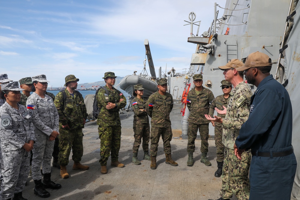 Sailors aboard USS Howard (DDG 83) conduct a shipboard tour for medical personnel during Sama Sama 2024 in Subic, Philippines