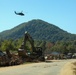 Guardsmen work together to clear debris in Bumpus Cove, Tennessee