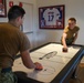 Accession-level Sailors have fun at the USO