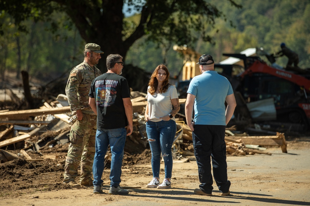 Guardsmen work together to clear debris in Bumpus Cove, Tennessee