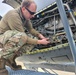 Airmen install propeller on jet engine test stand