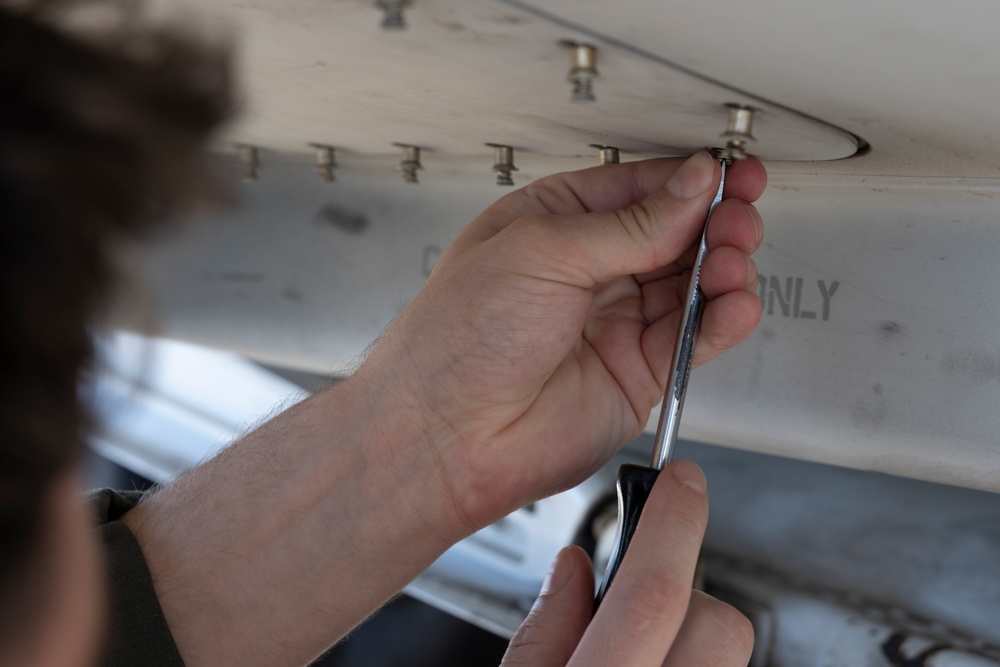 U.S. Marines with Marine Aerial Refueler Transport Squadron (VMGR) 252 conduct routine maintenance