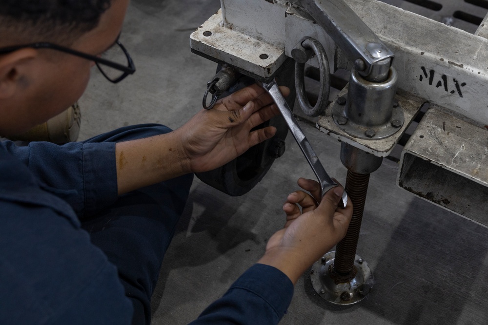 U.S. Marines with Marine Aerial Refueler Transport Squadron (VMGR) 252 conduct routine maintenance