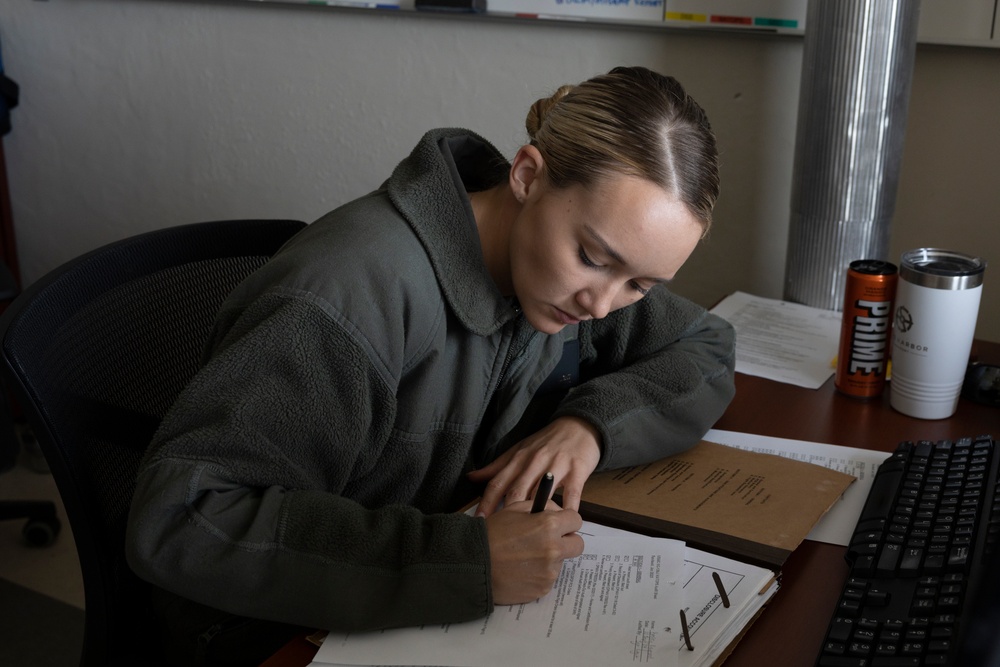 U.S. Marines with Marine Aerial Refueler Transport Squadron (VMGR) 252 conduct mission planning